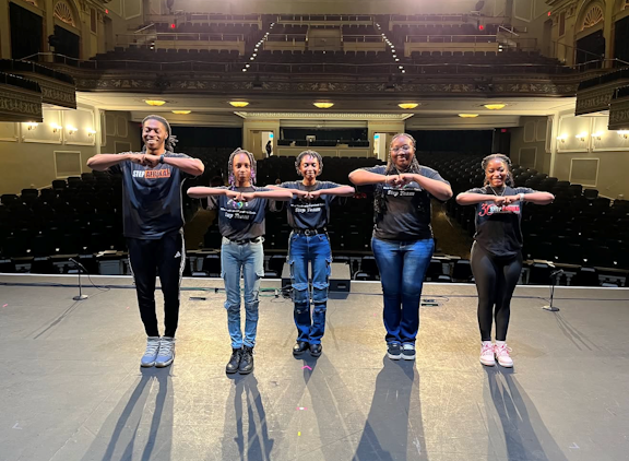 Youth learning a step routine